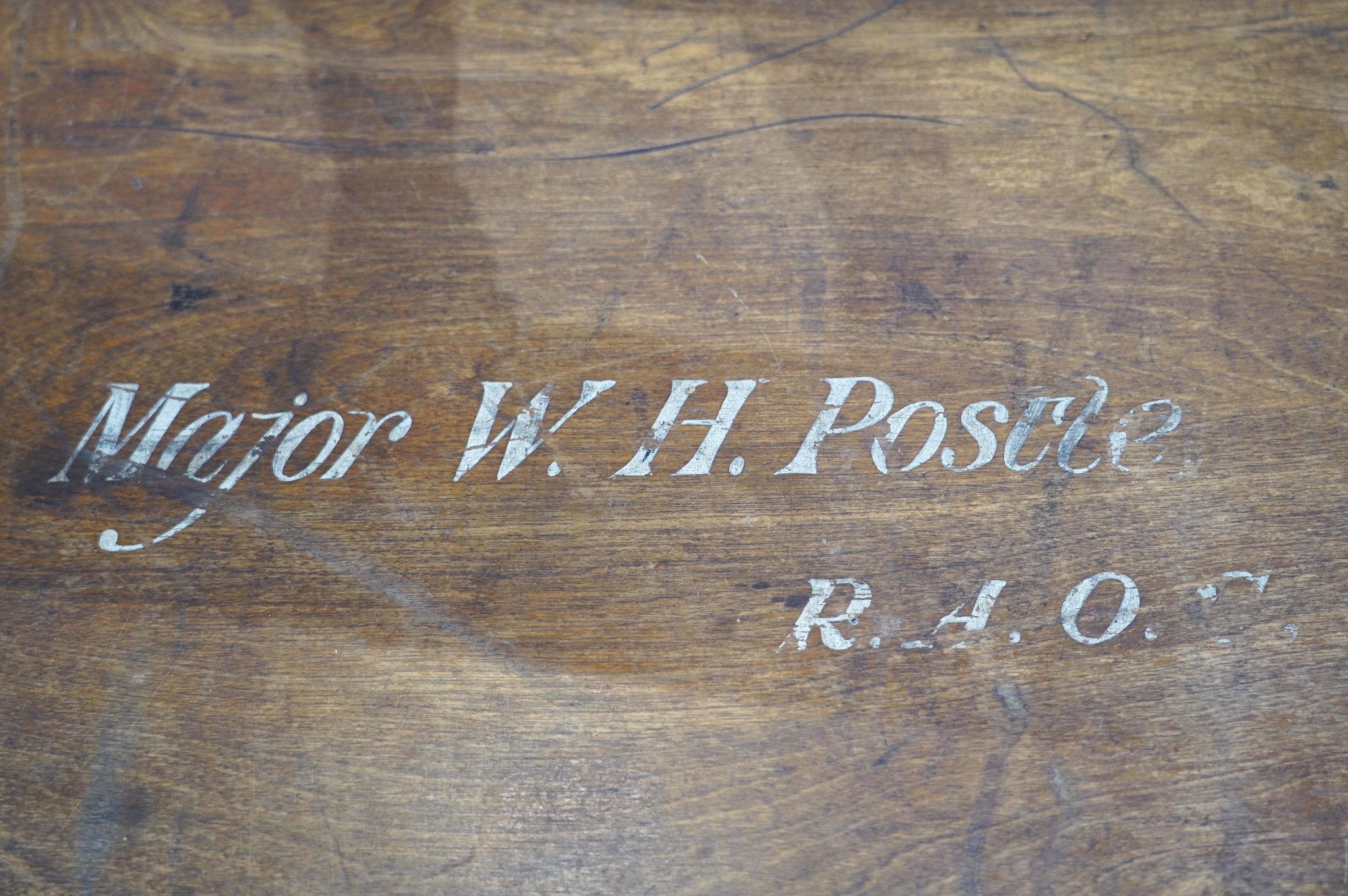A pine military trunk with steel banding to all edges and corners, and original tin lining, owner’s name painted to the lid; ‘Major W.H. Postle R.A.O.C.’, 91.5cm wide, 54cm deep, 53cm high. Condition - fair to good